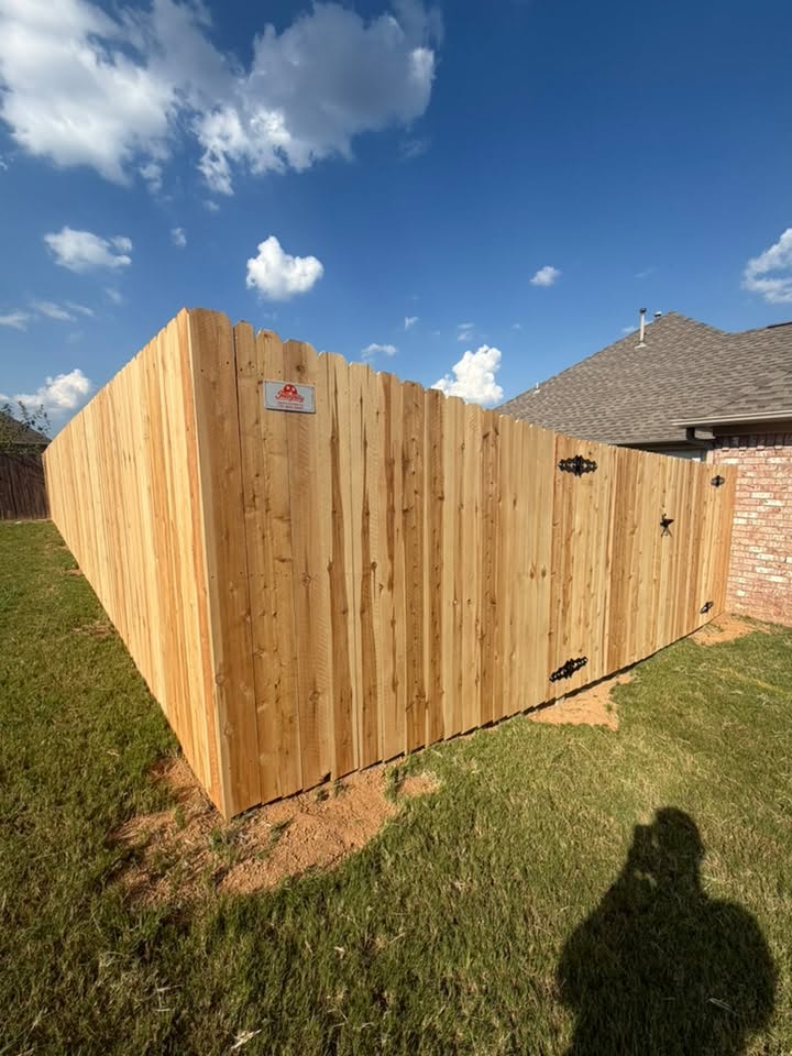 Wood fence with double gate built by Integrity Fence and Outdoor