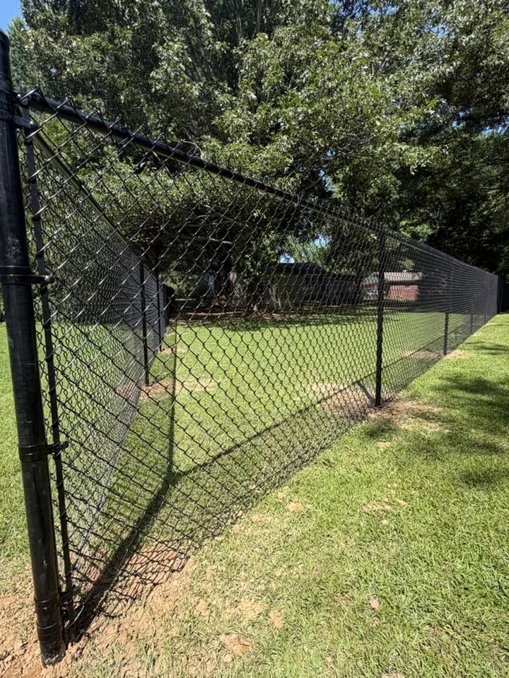 Black chain-link fence built by Integrity Fence and Outdoor